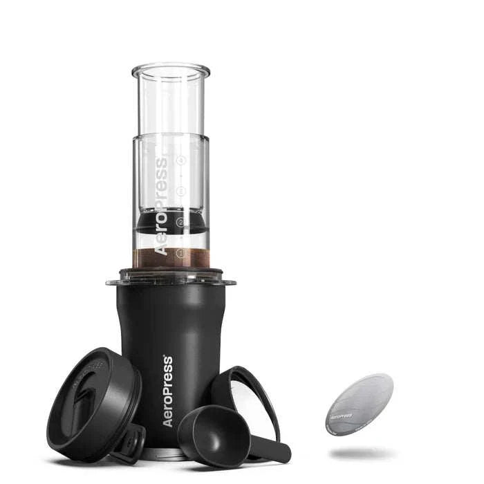 AeroPress Go Plus portable coffee maker set in black with accessories for specialty coffee brewing