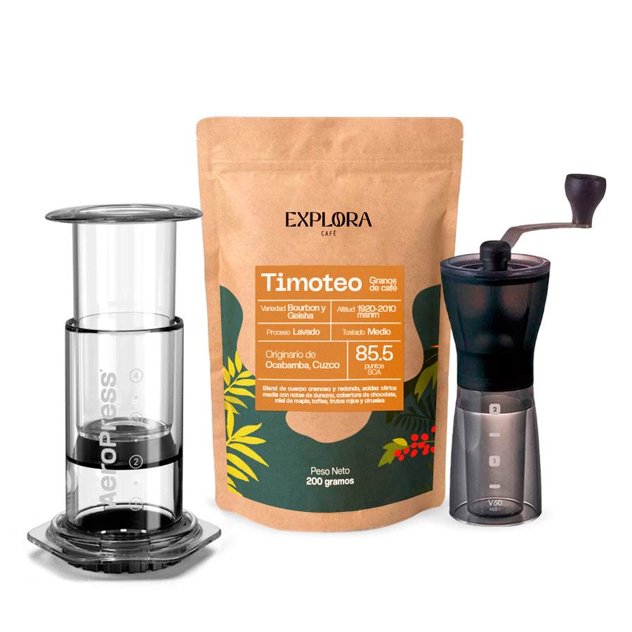 Clear AeroPress coffee maker with Hario Slim manual grinder and Timoteo specialty coffee pack