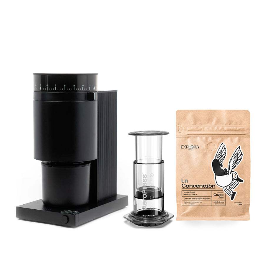 Starter pack with black Fellow Opus coffee grinder, transparent AeroPress Clear coffee maker, and La Convención specialty coffee bag